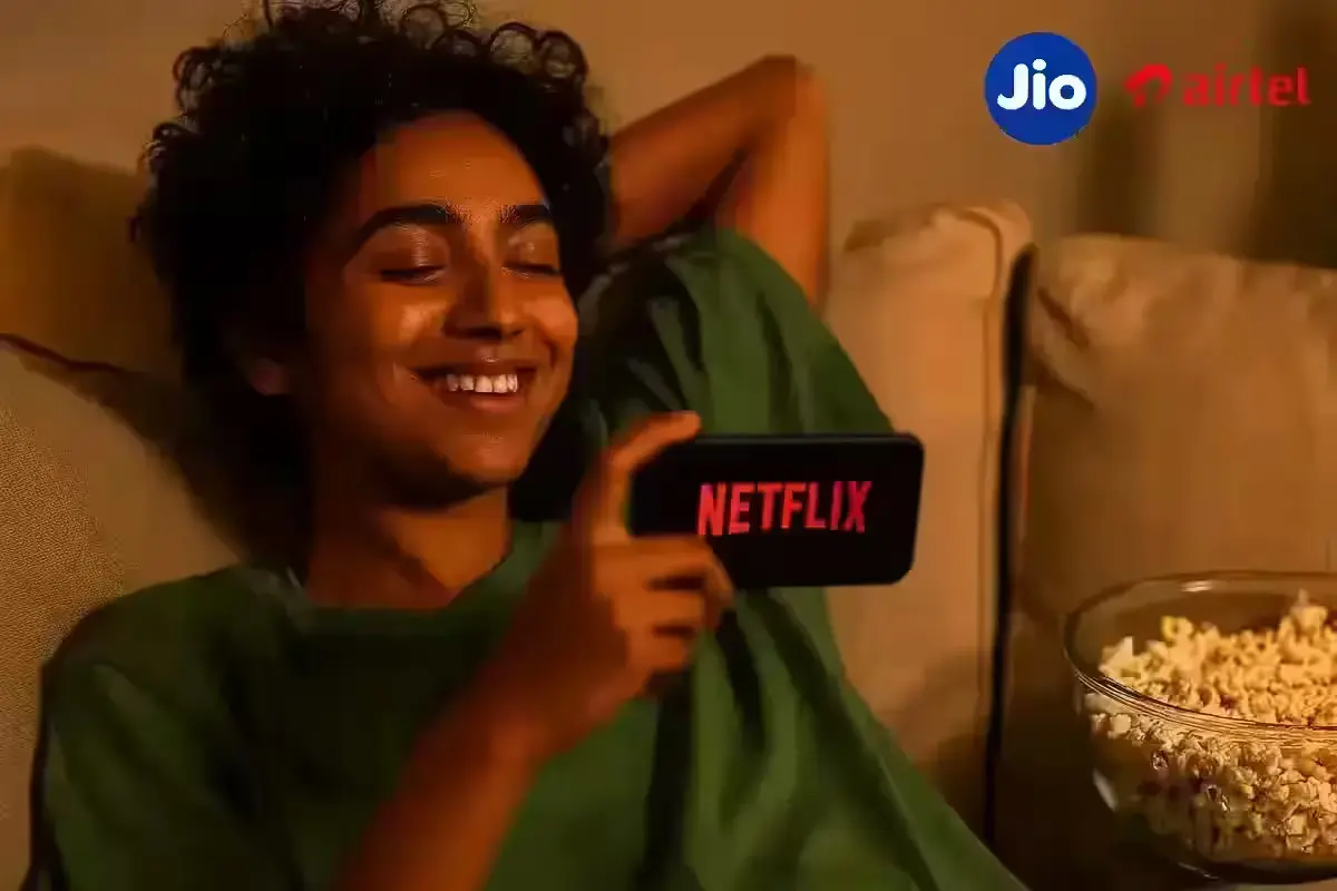 Jio’s Ultimate Offer: Free Netflix & Hotstar in 84-Day Recharge Pack Person streaming Netflix using Jio or Airtel OTT offer