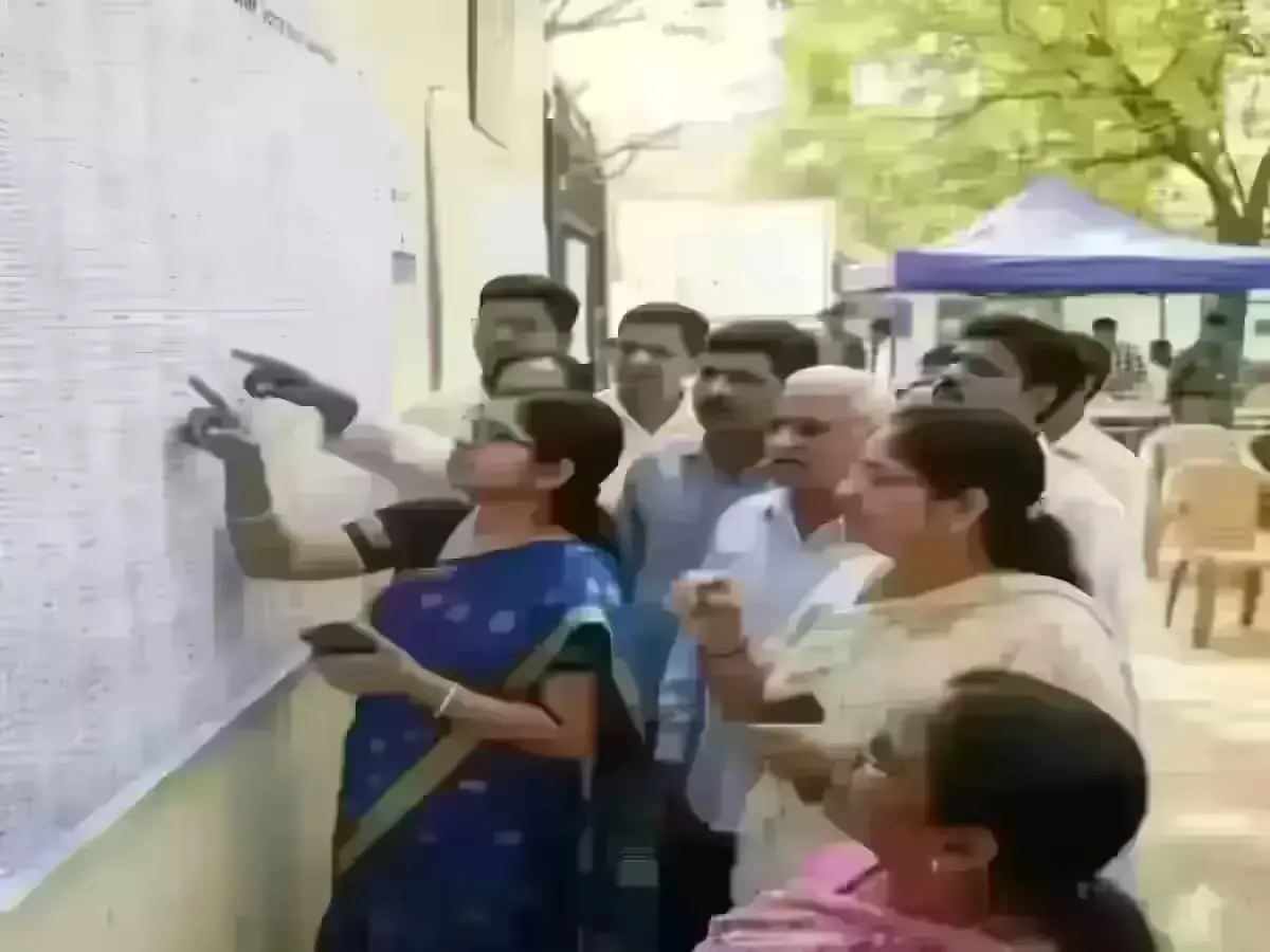 Voters checking names on updated ECI voter list at local center